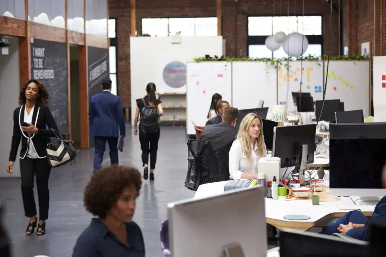business team working at desks in modern open plan 2024 10 19 11 08 51 utc